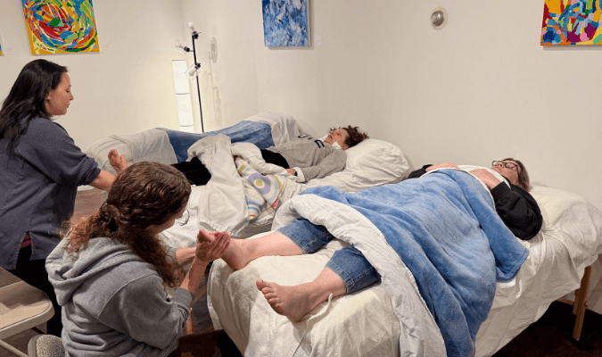 Reflexology students studying a higher consciousness and holistic mindset