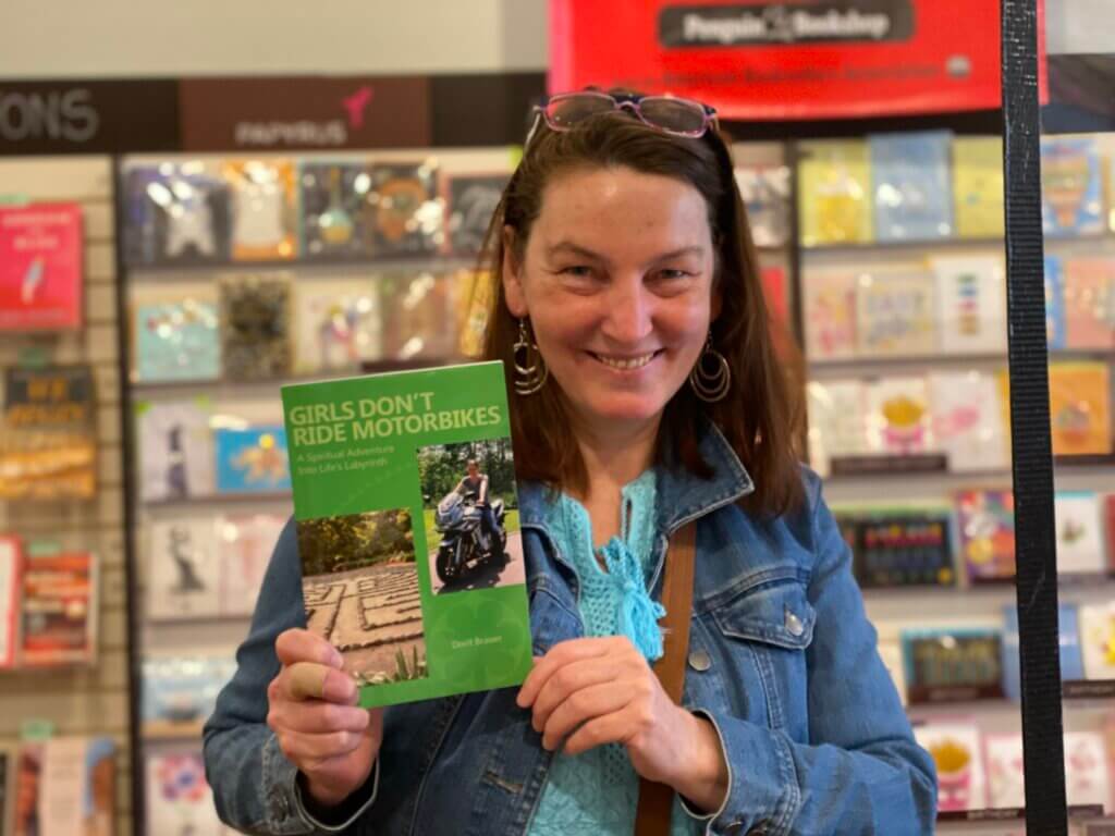 Dorit, Family Constellations expert, holding up her memoir.